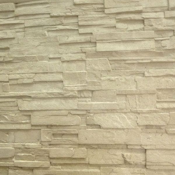 A textured precast concrete retaining wall panel