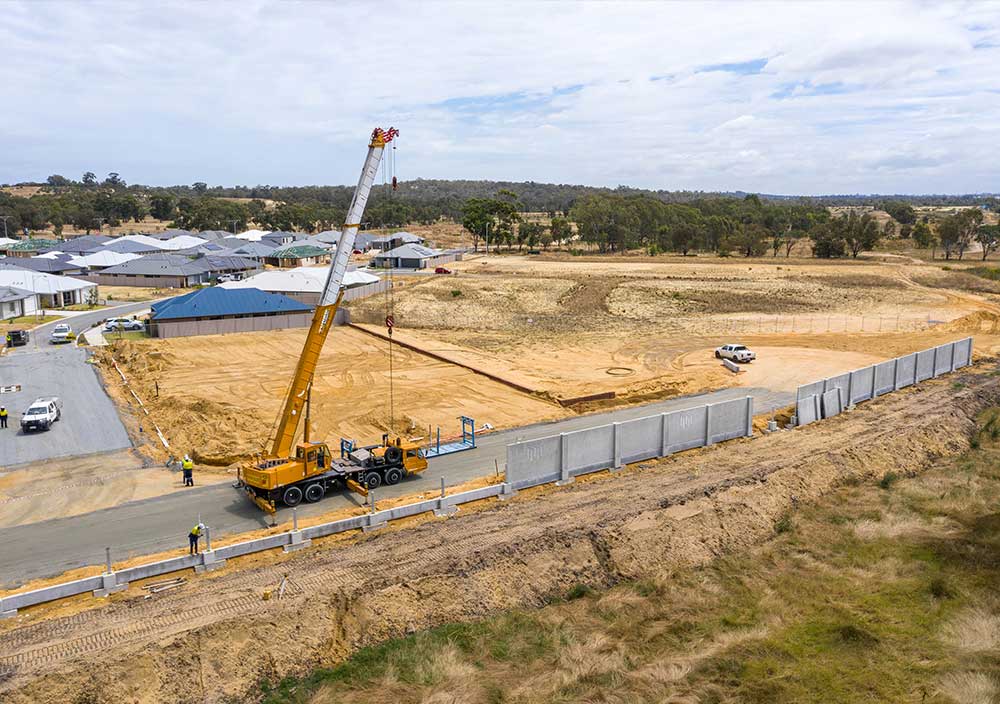 A precast concrete retaining wall system being installed by Smartstream Technology